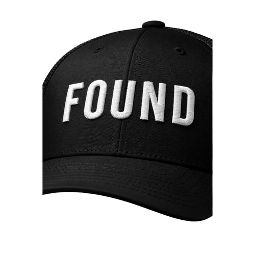 Black cap with 'FOUND' embroidered on it against a white background