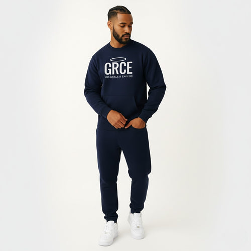 Man wearing a navy blue sweatshirt and pants with 'GRCE' logo on a white background