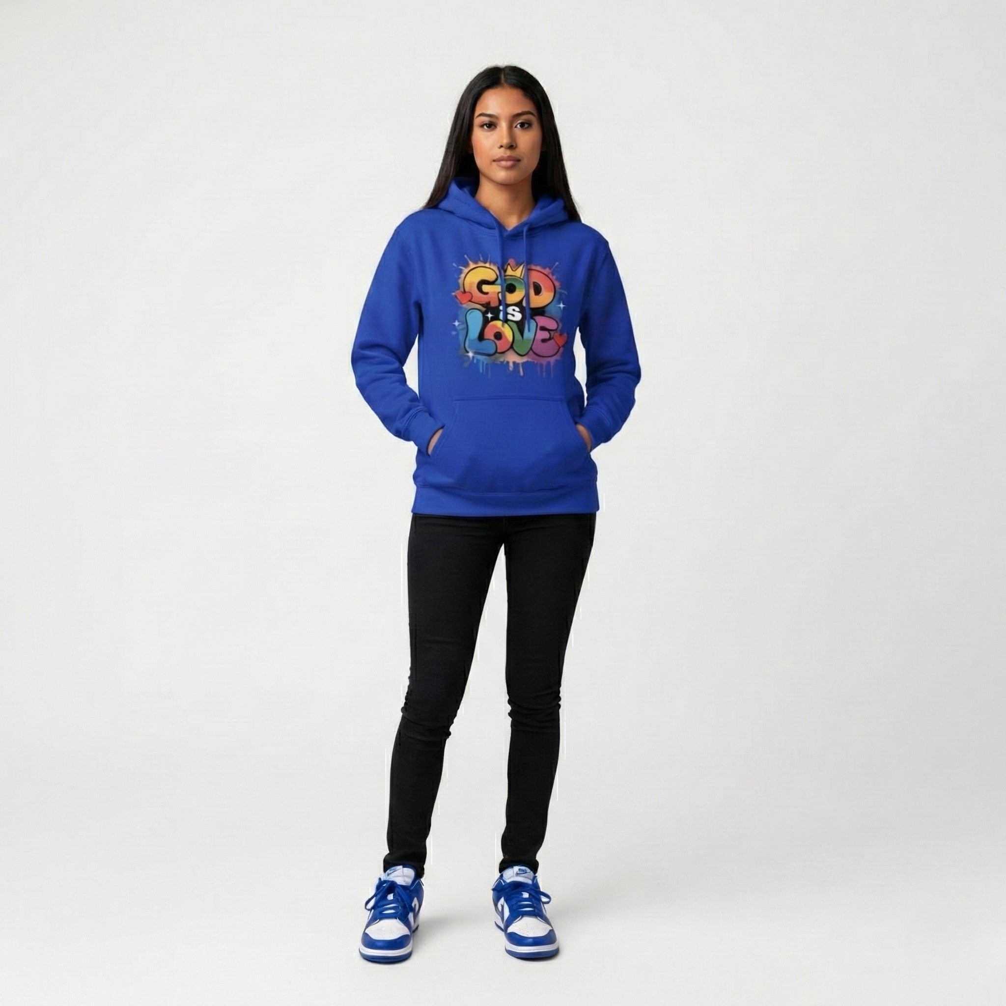 Person wearing a blue hoodie with colorful text design on a white background