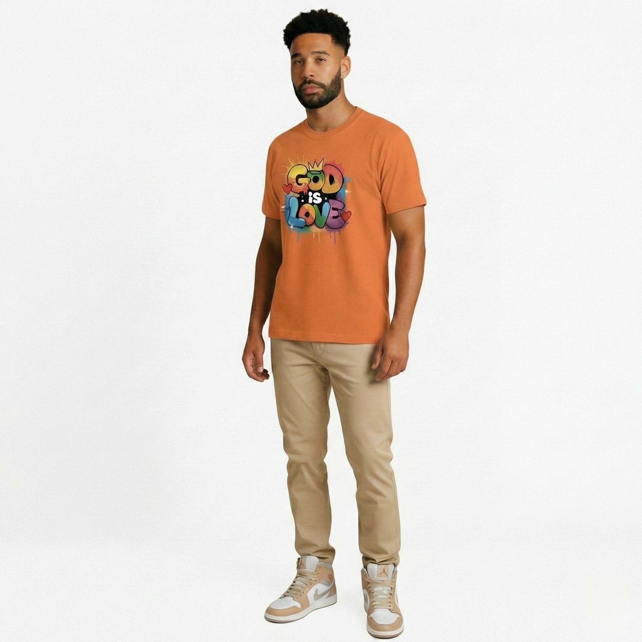 Man wearing an orange t-shirt with 'God is Love' text on a white background