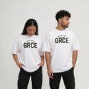 Two people wearing white t-shirts with 'GRCE' printed on them against a plain background