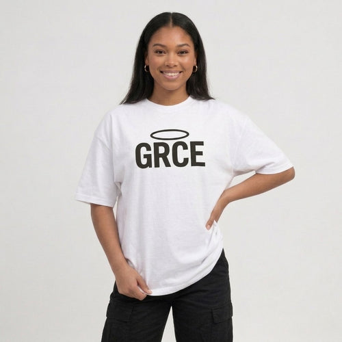 Person wearing a white t-shirt with 'GRCE' printed on it against a plain background