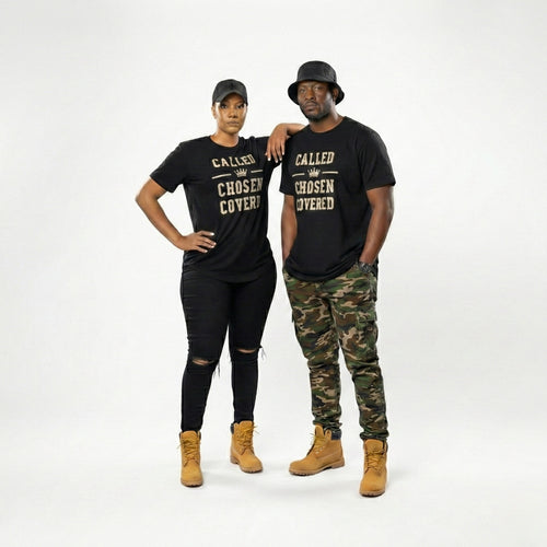Two people wearing matching black t-shirts with text, standing against a white background.