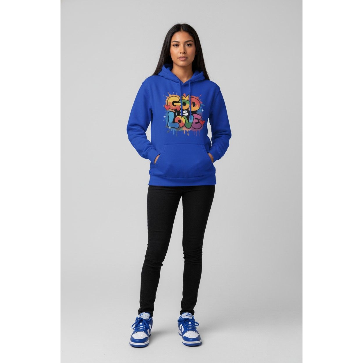 Person wearing a blue hoodie with 'God is Love' text on a gray background