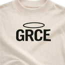 Cream t-shirt with 'GRCE' printed on it