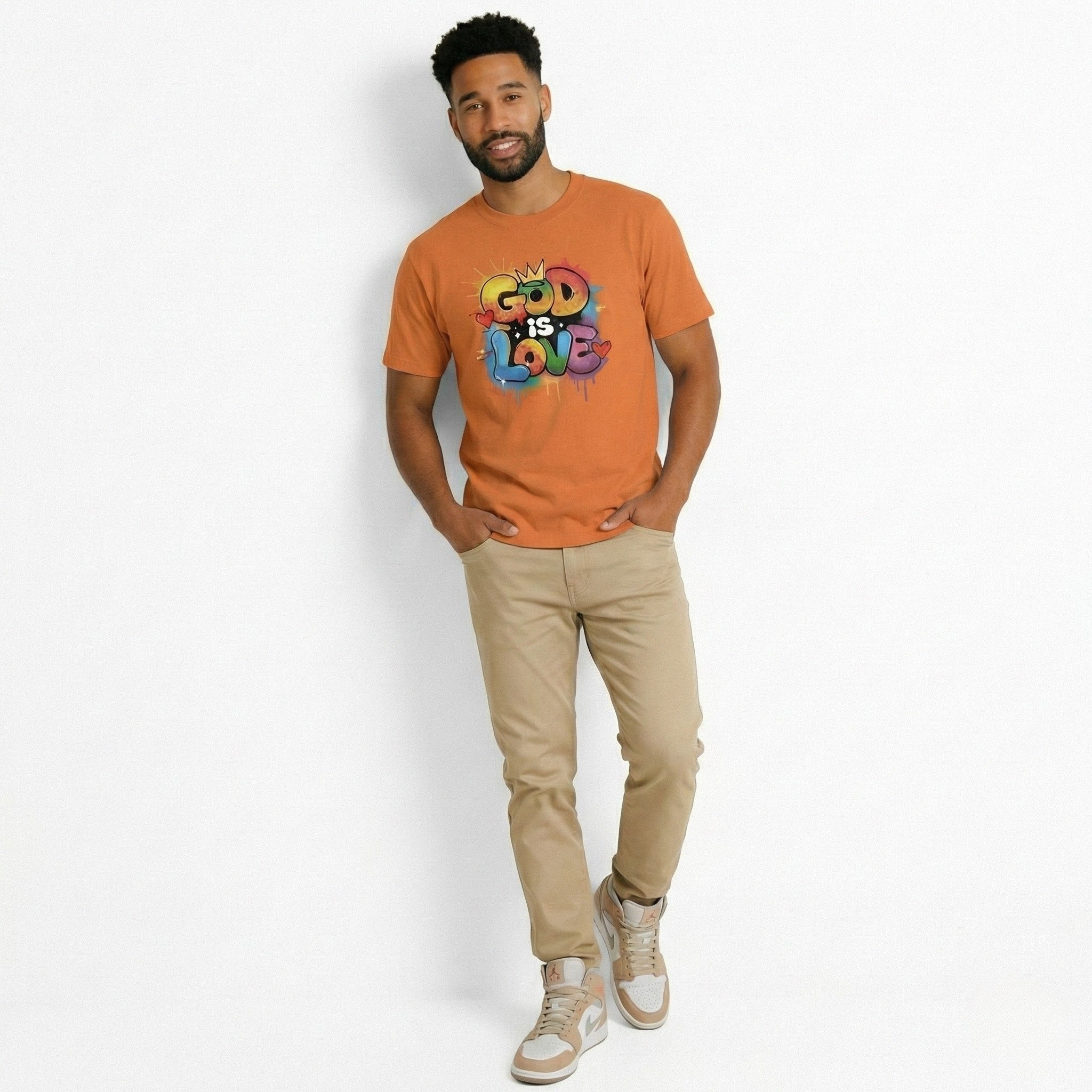 Man wearing an orange t-shirt with 'God is Love' text on a white background