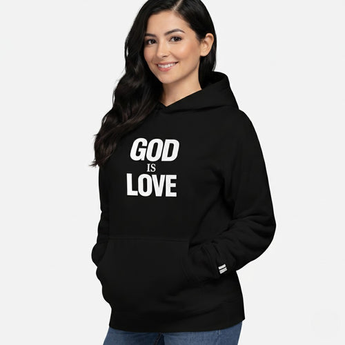 Woman wearing a black hoodie with 'GOD IS LOVE' text on a white background