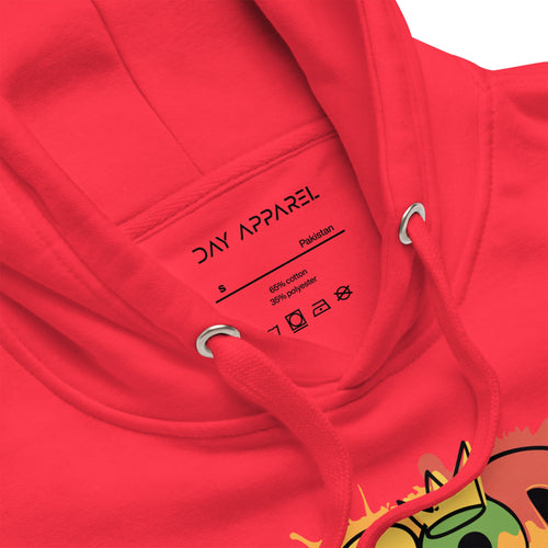 Close-up of a red hoodie with 'DAY APPAREL' label and colorful design on sleeve.