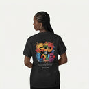 Person wearing a black t-shirt with 'GOD IS LOVE' in colorful letters on the back.