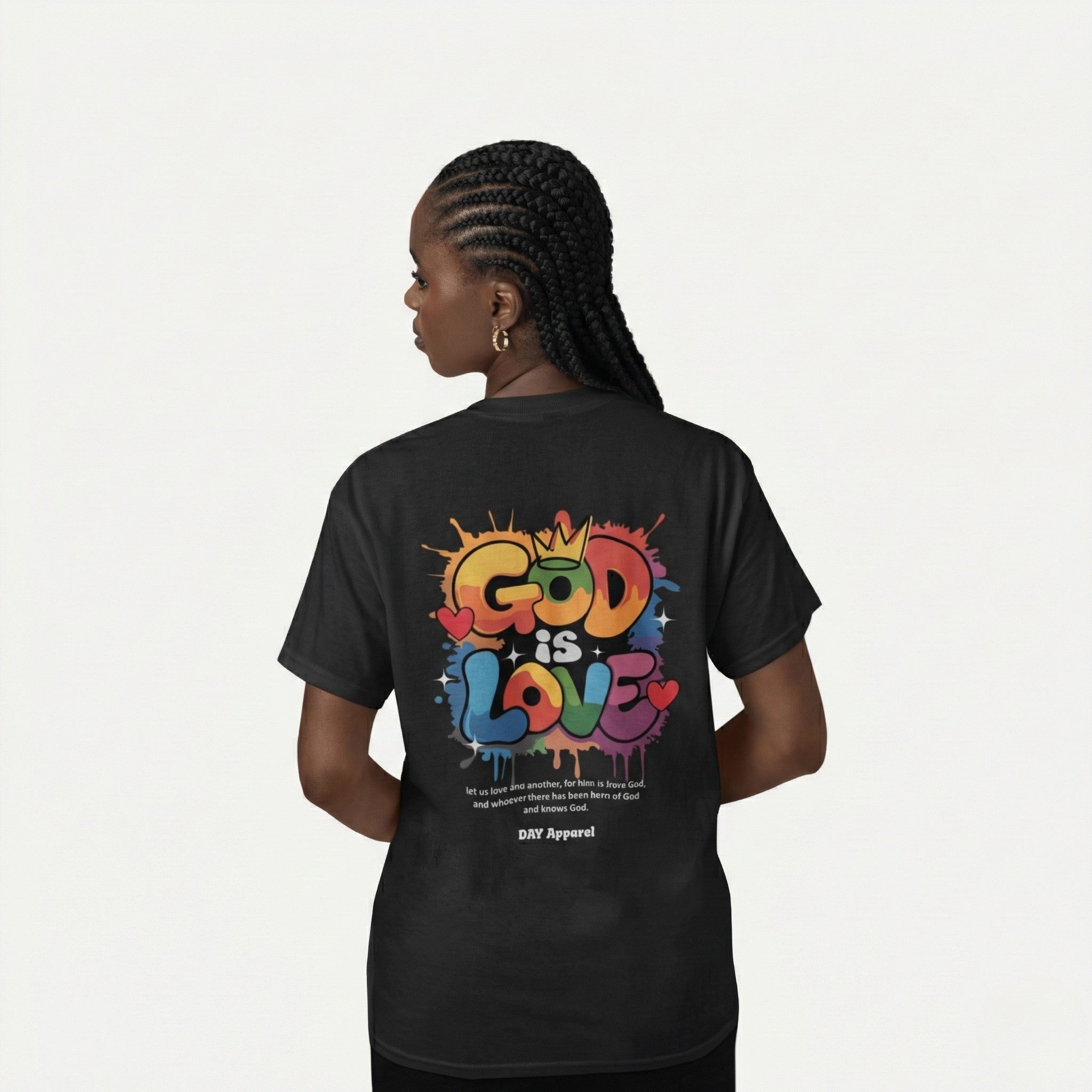Person wearing a black t-shirt with 'GOD IS LOVE' in colorful letters on the back.