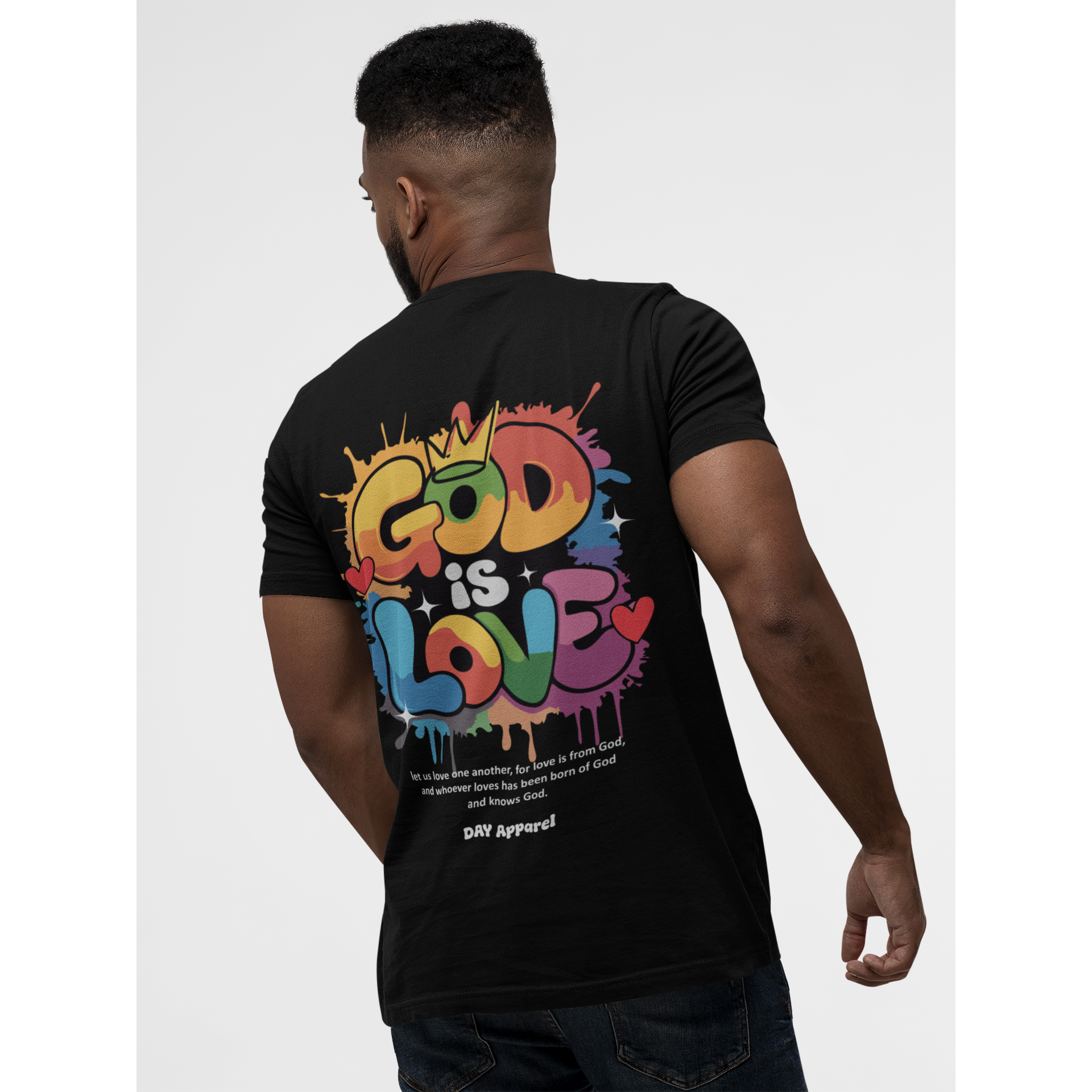 Person wearing a black t-shirt with 'God is Love' colorful design on the back.